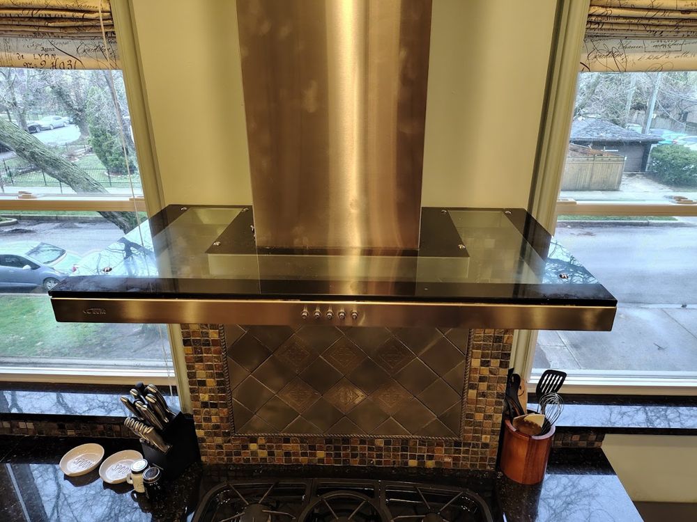 Finished glass replacement on a kitchen range hood