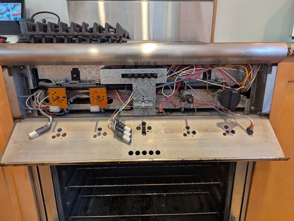 Oven control panel opened up on a range